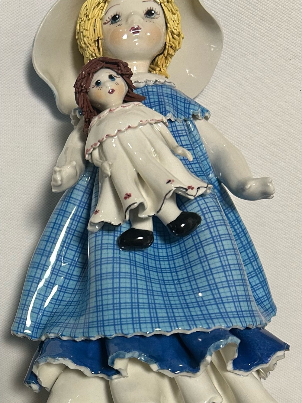 lino zampiva Porcelain Girl Figurine in Blue Plaid Dress with Doll 9 High 5 wide